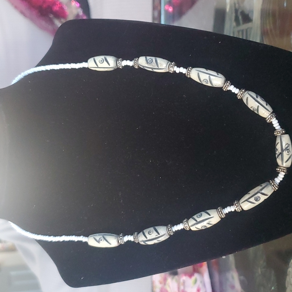Man's bone necklace.